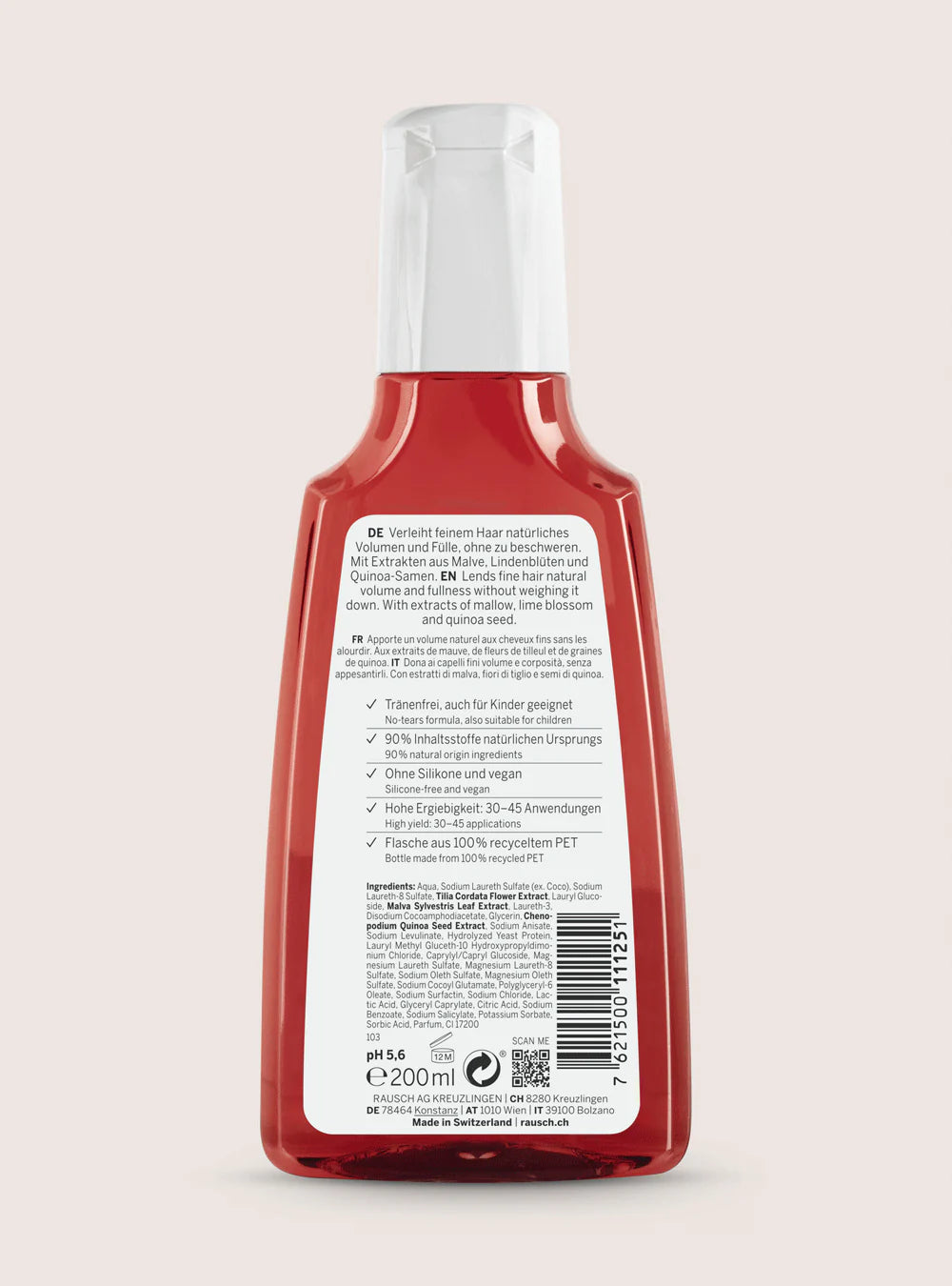 The back of a red plastic bottle with a white cap, showing the white product label with text, barcode, and QR code, set against a solid pale pink background.