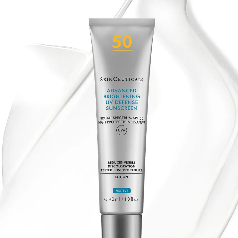 A tube of SkinCeuticals Advanced Brightening UV Defense Sunscreen Lotion SPF 50, shown against a white background with elegant liquid swirls.