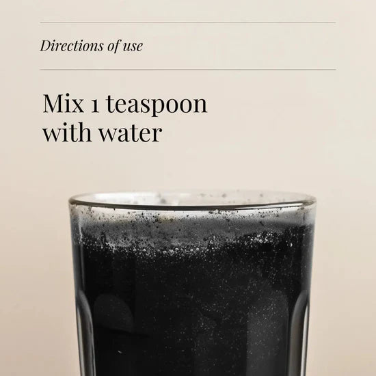 Instructional graphic with the text 'Directions of use' and 'Mix 1 teaspoon with water' above a close-up of a dark beverage in a clear glass against a light beige background.