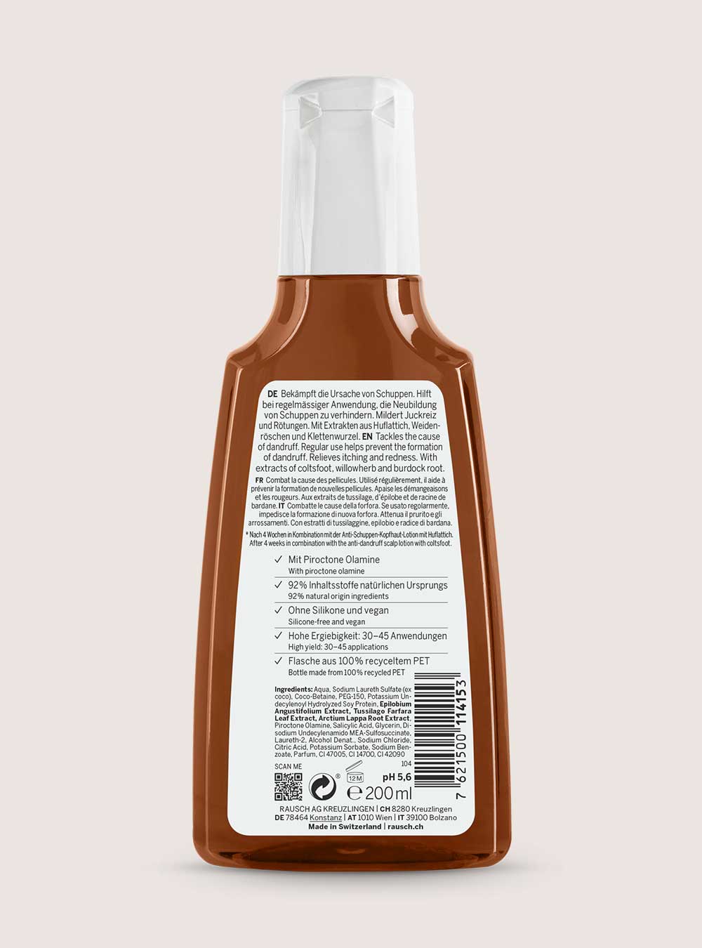 Brown bottle with label on a light pink background