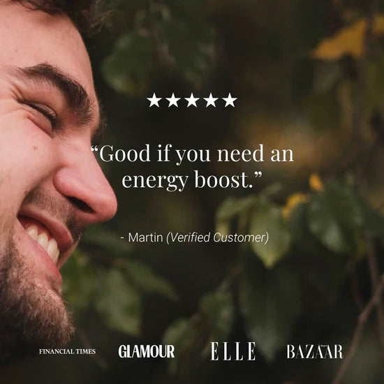 A close-up side profile of a smiling man against a blurred outdoor background of green leaves, with overlaid text reading a five-star review quote attributed to Martin (Verified Customer). Small magazine logos for Financial Times, Glamour, Elle, and Bazaar appear along the bottom.
