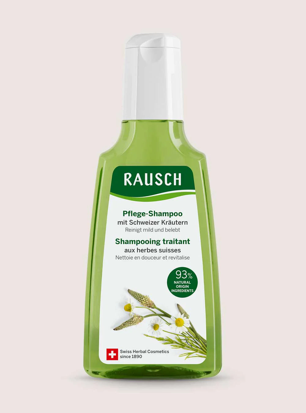 A bottle of Rausch herbal shampoo with a translucent light green body, white cap, and a white label featuring green text and illustrations of chamomile flowers, set against a solid pale pink background.