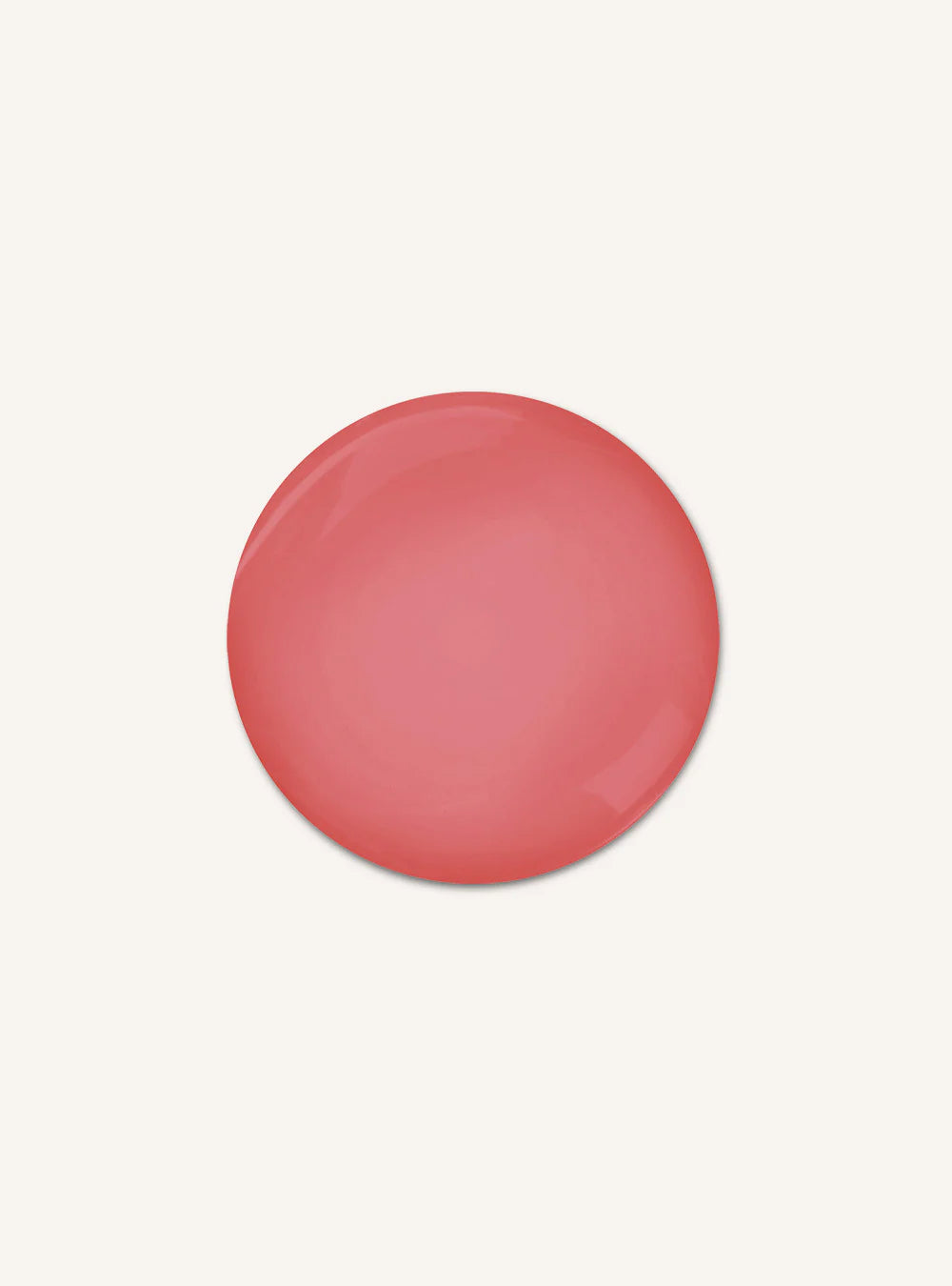 A smooth, glossy circular swatch of coral pink color centered on a solid off-white background.