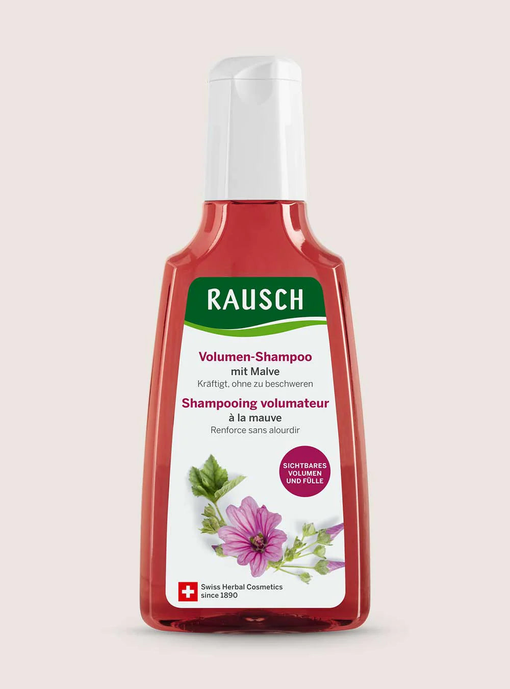 A bottle of Rausch Volumen-Shampoo with Malve (volume shampoo with lavender) on a solid pale pink background. The bottle is translucent red with a white flip-top cap and a white label featuring green, pink, and purple details.