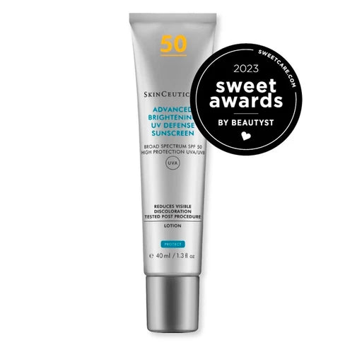 A silver tube of SkinCeutical Advanced Brightening UV Defense Sunscreen Lotion with SPF 50, featuring a black circular Sweetest Awards 2023 badge overlay on the right side.